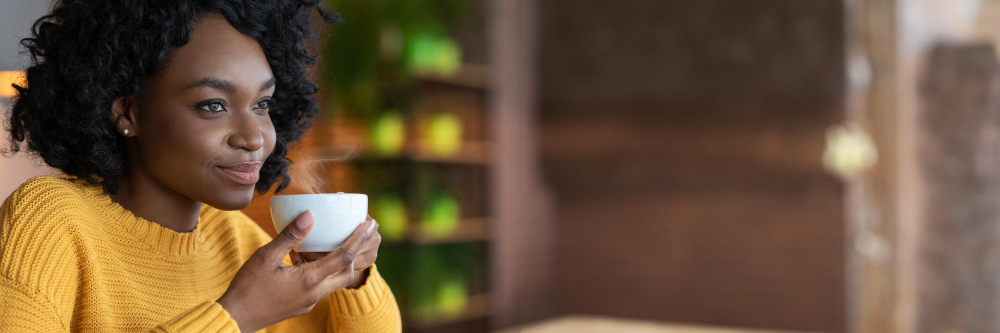 Woman enjoying a warm drink sweetened with Bamboo Stevia